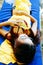 Beautiful girl resting on sunbed during vacation on the beach. Relaxed woman sunbathing and relaxing lying on deck chair at tropic