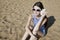 Beautiful girl with a seashell on the beach