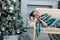 Beautiful girl sleeps near the christmas tree and gifts in boxes - christmas and new year concept