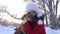 Beautiful girl smiles, caresses her beloved dog in winter in park. girl with a hunting dog walks in winter in forest