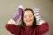 Beautiful girl smiling with different socks