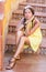 Beautiful girl on the stairs decorated with ceramic tiles. Sicily