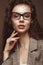 Beautiful girl in stylish clothes with glasses for vision. Beauty face.