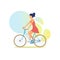 Beautiful girl in summer dress rides multicolored bicycle