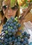 Beautiful girl with sunglasses picked grapes