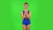 Beautiful girl in a swimsuit coquettishly is laughing. Green screen