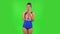 Beautiful girl in a swimsuit is surprised and rejoicing. Green screen