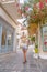 Beautiful girl tourist walking in the streets of Poros city, Greece