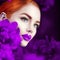 Beautiful girl with violet peony flowers portrait. Beauty fashion redhead model woman face