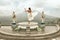 Beautiful Girl In White Dress Fluttering In Wind Looking At Agung Volcano In Bali, Indonesia.