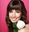 Beautiful Girl And White Rose. Healthy Long Curly Hair. close up