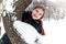 Beautiful girl on winter snow background. Spectacular long-haired girl