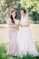 Beautiful girls Bride and bridesmaid with a bouquet