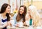 Beautiful girls drinking coffee in cafe