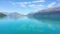 Beautiful glacial Lake Wakatipu and Southern Alps on a sunny day.