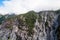 A beautiful glacier waterfall falling from high rocky mountains