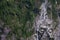 A beautiful glacier waterfall falling from high rocky mountains