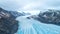 Beautiful glaciers flow through the mountains in Iceland. Aerial view and top view