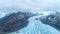 Beautiful glaciers flow through the mountains in Iceland. Aerial view and top view