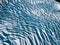 Beautiful glaciers flow through the mountains in Iceland. Aerial view and top view. Flowing Glacier in Greenland.