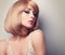 Beautiful glamour makeup blond woman with short hair style. Clos
