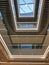 Beautiful glass balconies and window in ceiling at modern business center