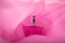 Beautiful glass romantic bottle of perfume fragrances in delicate pink veil haze pair, soft focus, selective focus. Close-up