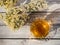 Beautiful glass teacup with Greek mountain herbal Vounou tea tea and dried mountain grass Sideritis syriaca on a wooden table in