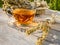 Beautiful glass teacup with Greek mountain herbal Vounou tea tea and dried mountain grass Sideritis syriaca on a wooden table in