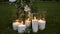 Beautiful glass vases with burning candles.Boho rustic decor. decorations for festive wedding ceremony