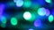 Beautiful glittering multicolored lights bokeh in dark blurry background at night, round colorful shine and go out. Abstract conce