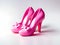 Beautiful glossy pink Barbie style shoes isolated on a white background