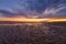 Beautiful glowing sunset reflections in sand ripples, Inverloch, Australia