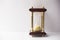 Beautiful gold-plated vintage hourglass on white background