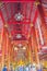 Beautiful golden buddha image under the red ceiling inside the public buddhist church at Wat Chiang Man, oldest temple in Chiang M