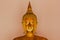 Beautiful golden Buddha On the pedestal, some white walls