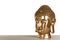 Beautiful golden Buddha sculpture on wooden table against grey background. Space for text