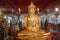 Beautiful golden Buddha statue at Wat Tha Sung, Uthai Thani Province, Thailand