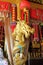 Beautiful Golden Buddhist statue dragon with a red cloth