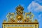 This is the beautiful golden entrance gate to the famous palace of Versailles in France