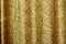 Beautiful golden glitter background with golden sequins. Sparkling sequined textile
