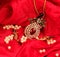 Beautiful Golden Indian necklace in red background