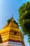 Beautiful golden pagoda with blue sky background at Wat Sri Suphan, Chiang Mai, Thailand