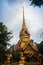 Beautiful golden pagoda with decorative Thai style fine art at public Buddhist Wat Phu Phlan Sung, Nachaluay, Ubon Ratchathani, Th
