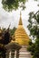Beautiful golden pagoda at Wat Phra Kaew, one of the oldest and most revered Buddhist temples in Chiang Rai, Thailand