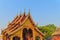 Beautiful golden patterned background on the Buddhist church gable end. Thai golden pattern background crafted on the gable in the