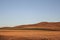 A beautiful golden red prairie under the blue sky