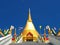 Beautiful golden stupa soars into blue sky