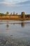 Beautiful, golden sunset casts warm light onto Angkor Wat, the ancient temple complex
in Cambodia