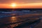 Beautiful golden sunset in the sea with saturated sky and clouds. Reflection in the water. Rocky coastal line. Peaceful serene lan